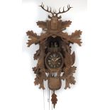Carved back forest cuckoo clock, 62cm high : For Further Condition Reports Please Visit Our Website,