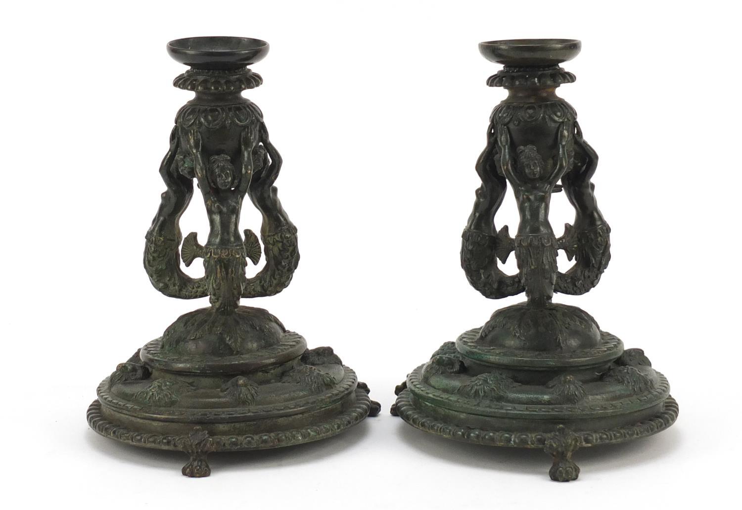 Pair of 19th century Renaissance style patinated bronze candlesticks, having detachable sconces