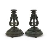Pair of 19th century Renaissance style patinated bronze candlesticks, having detachable sconces