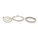 Three silver bracelets including one set with black and clear stones, 65.2g : For Further