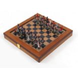Painted lead chess set in the form of soldiers with board, the largest piece 6.5cm : For Further