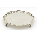 Atkin Brothers, Georgian style silver salver raised on four scroll feet, Sheffield 1935, 20.5cm in