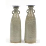 Pair of Korean pottery vases with twin handles having a celadon type glaze, each 36.5cm high : For