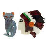 Two Art Deco design brooches in the form of a Native American's head and a stylised cat, the largest