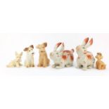 Pair of Staffordshire style rabbits and a group of four dogs including Sylvac, the Rabbit 25cm in