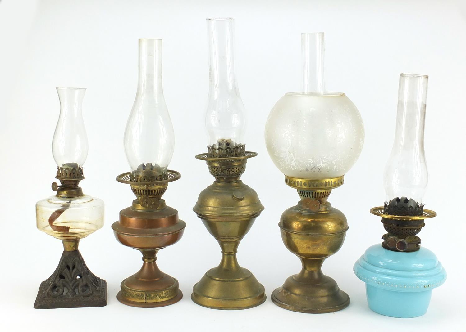 Five brass and glass oil lamps, the largest 51cm high : For Further Condition Reports Please Visit - Image 2 of 5