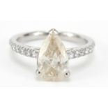 Platinum pear shaped diamond ring, set with fourteen diamonds to the shoulders, size L, 4.3g : For
