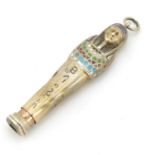 Egyptian Revival silver gilt and enamel propelling pencil in the form of Tutankhamun, 6cm in length,