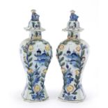 Pair of Dutch Delft pottery vases and covers hand painted with village scenes, 21cm high : For