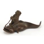 Japanese patinated bronze figure of a kitten riding a catfish, impressed marks to the base, 12cm