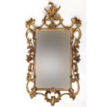 Ornate gilt framed pier mirror with acanthus leaves and C scrolls, 102cm x 58cm : For Further