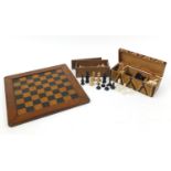 Three sets of wooden and composite chess pieces and a inlaid oak chess board, 43.5cm x 43.5cm :