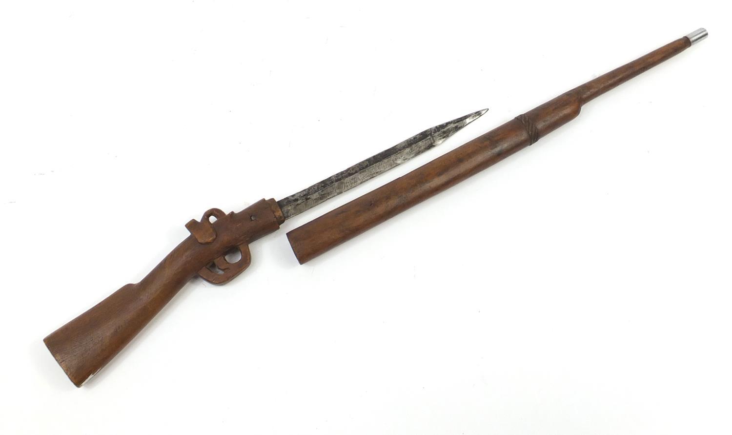 African carved wood sword stick in the form of a rifle, 86cm in length : For Further Condition - Image 3 of 4