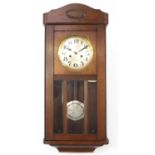 1930's oak case chiming wall clock with bevelled glass and silvered dial having Arabic numerals,