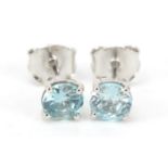 Pair of 9ct white gold blue zircon stud earrings, 5mm in diameter, 1.1g : For Further Condition