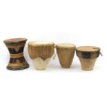 Three African animal skin drums and a seat with leather top, the largest 42cm high : For Further
