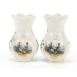 Pair of Continental porcelain vases hand painted with panels of courting couples and flowers,