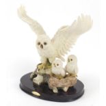 Julianna Collection model of a snowy owl with chicks on oval plinth, 23.5cm high : For Further