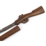 African carved wood sword stick in the form of a rifle, 86cm in length : For Further Condition