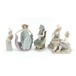 Four Lladro and Nao figure groups, the largest 23cm high : For Further Condition Reports Please