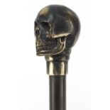 Hardwood walking stick with bronzed skull design pommel, 90cm in length : For Further Condition