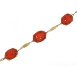 14ct gold carnelian bracelet carved with birds amongst flowers, 20cm in length, 12.2g : For