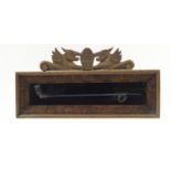 Carved oak glazed case housing a glass church warden's pipe, the frame 27cm high x 57.5cm wide : For