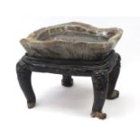 Large Chinese carved rock crystal tea table on hardwood base, carved with mythical creatures and