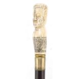 Hardwood walking stick with carved bone phrenology head pommel, 90cm in length : For Further