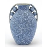 French Art Deco twin handled pottery vase having a blue glaze, numbered 595 to the base, 19.5cm high