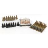 Two carved stone chess sets with boards and one other chess set, the largest piece 9cm high : For