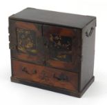 Japanese lacquered marquetry inlaid table cabinet fitted with two doors enclosing six drawers