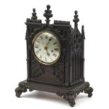 19th century cast iron Gothic bracket clock striking on a bell, with silvered dial and Roman