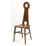Arts & Crafts mahogany hall chair with stylised tree and floral carved back, 108cm high : For