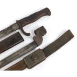 German military interest Mausel sawback bayonet with scabbard by Waffenfabrik and one other, the