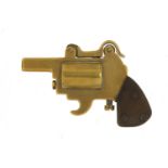 Novelty brass lighter in the form of a pistol with bakelite grip, 8.5cm in length : For Further