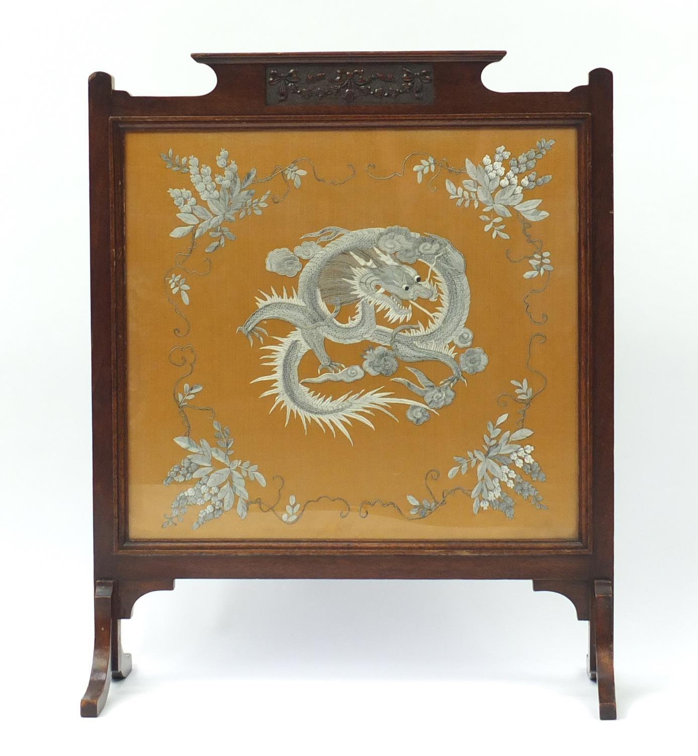 Chinese silk panel embroidered with a dragon and flowers, housed in a carved mahogany screen, - Image 2 of 3