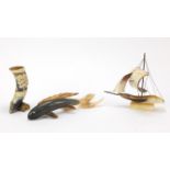 Three decorative horn carvings comprising a fish, galleon and cornucopia, the fish 26cm long : For