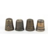 Four silver thimbles including one with a Stanhope and niello work, the largest 2.2cm high, 24.