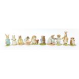 Ten Beswick Beatrix Potter figures comprising Mrs Rabbit and Peter, Timmy Willie, Tom Kitten in