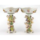 Large pair of Dresden floral encrusted porcelain centrepieces with pierced baskets on naturalistic