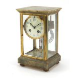 19th century French onyx and brass four glass mantle clock striking on a gong, the enamelled dial