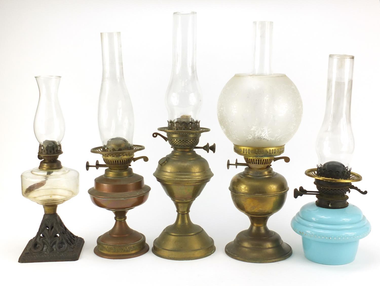 Five brass and glass oil lamps, the largest 51cm high : For Further Condition Reports Please Visit - Image 3 of 5