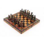 Hand painted terracotta Aztec design folding chess set with board, the largest piece 6.5cm high :