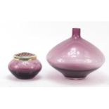 Two purple glass vases including a Caithness example etched with flowers, the largest 19cm high :