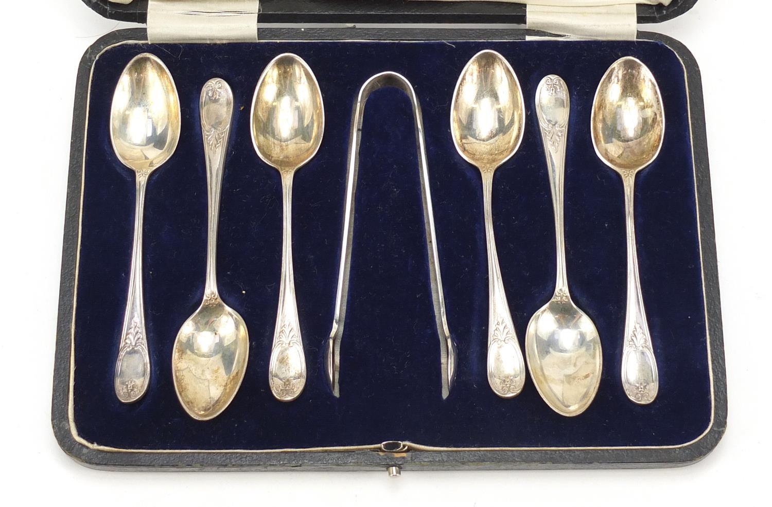 James Dixon & Sons, Set of six George V silver teaspoons and sugar tongs housed in a Harrods case, - Image 2 of 6