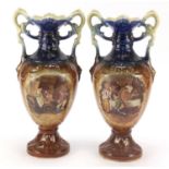 Pair of Victorian porcelain vases with twin handles decorated with tavern scenes, each 39cm high :