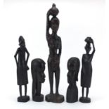 African carvings comprising pair of busts, pair of figures and one other, the largest 49cm high :