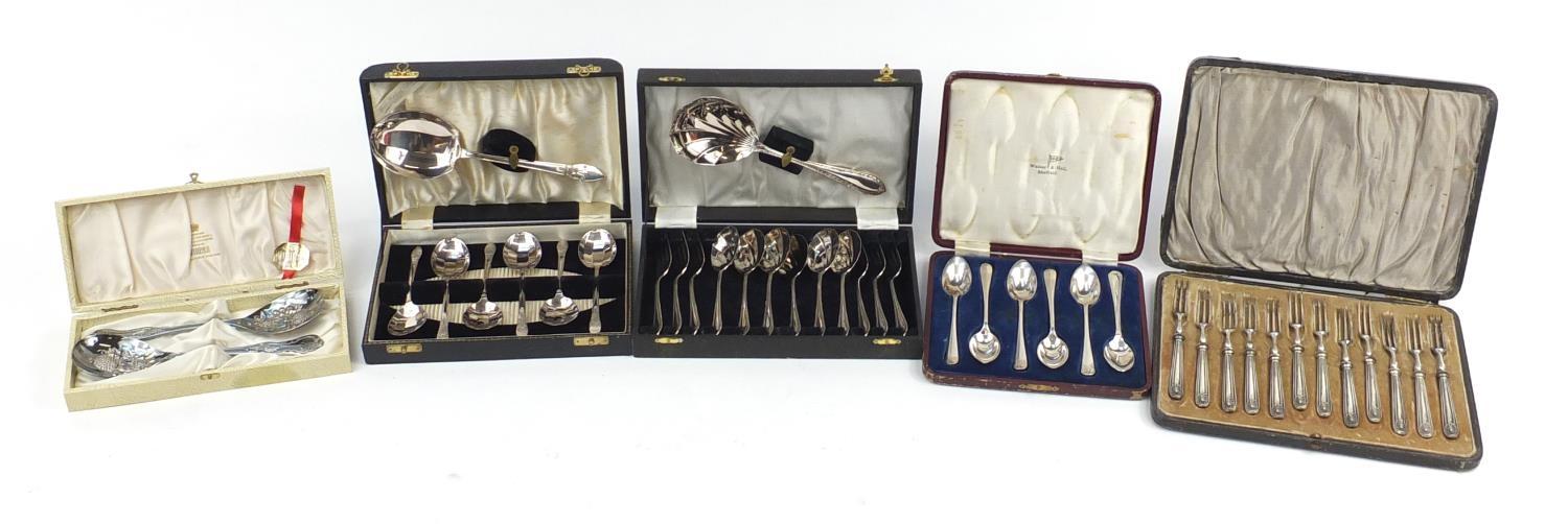 Five cutlery sets housed in fitted boxes, the largest 27.5cm wide : For Further Condition Reports