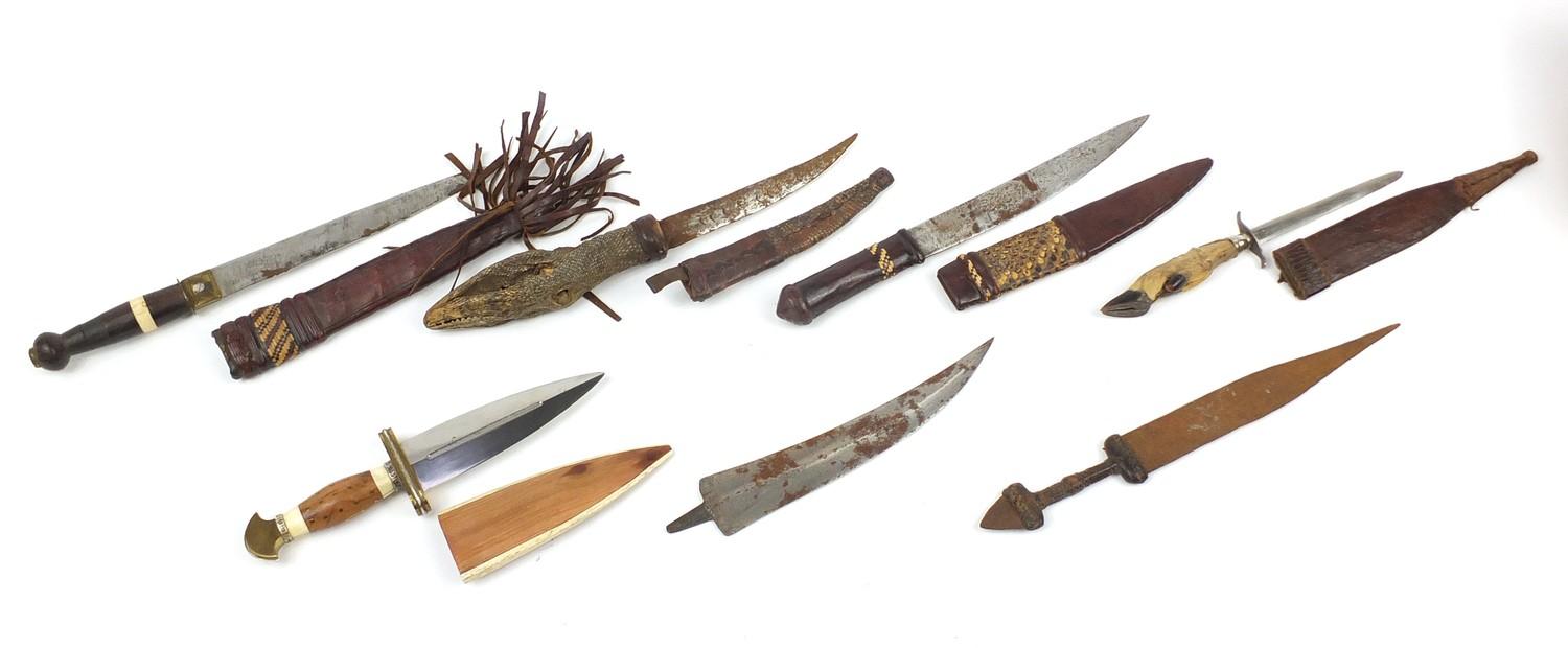 Seven daggers including a taxidermy interest example with lizard head handle, the largest 35cm in - Image 6 of 9